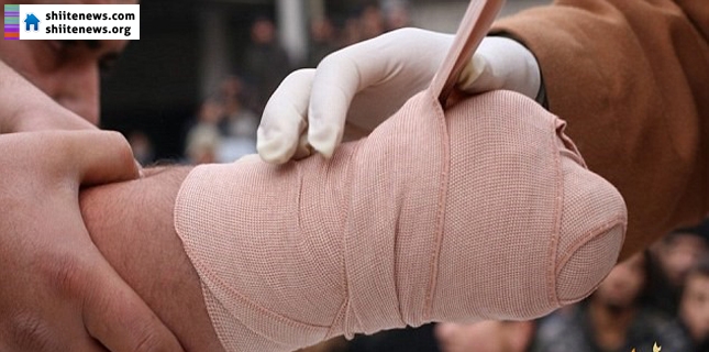 ISIS release horrific photos of a man having his hand amputated for theft and an ‘Assad spy’ being crucified in the streets of Syria