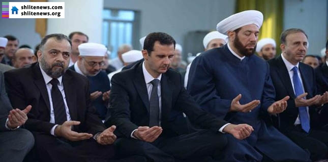 Syria’s Assad Makes Rare Public Appearance at Eid Prayers