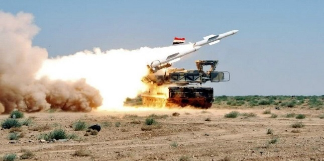 Syrian air defenses intercept missiles near Homs
