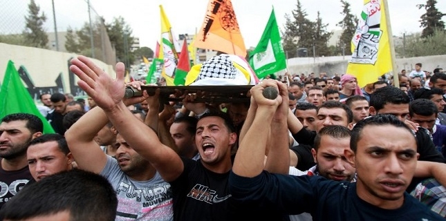 Israeli forces shoot dead a 13-year-old boy