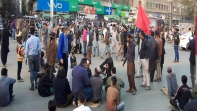 Karachiites sit near port protest massacre of Hazara Shia coalminers