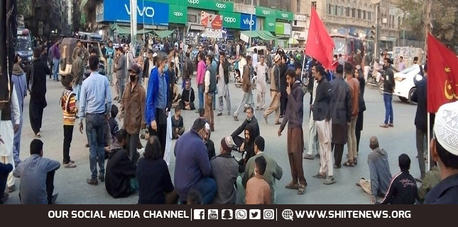 Karachiites sit near port protest massacre of Hazara Shia coalminers
