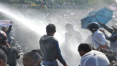 Fears of military crackdown as Myanmar police use water cannon against anti-coup protesters