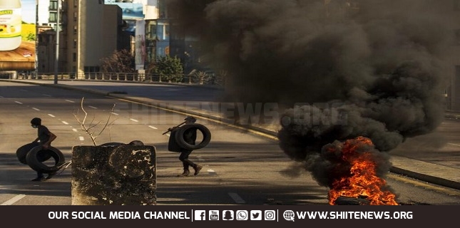 Lebanese protesters block roads, burns tires over economic hardships
