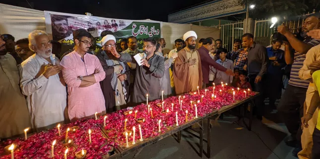 Prayer, lighting in memory of Shaheed Naveed Ashiq and students martyred in Afghanistan