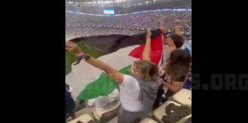 Football fans raise Palestine flag at FIFA World Cup during Argentina vs France match