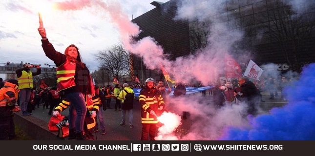 For third night, Paris police clash with protesters demanding President Macron resign