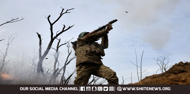 Ukrainian service members operate in the trenches at the frontline in Bakhmut region