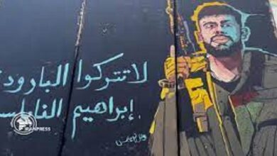 Ibrahim al-Nabulsi's picture carved on apartheid wall