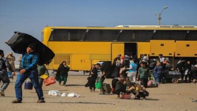 Scores killed after bus carrying returning Afghan migrants hits truck