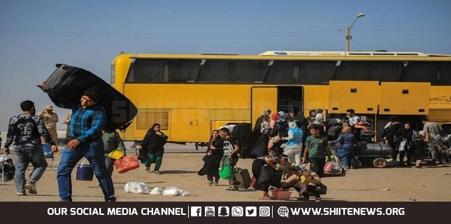 Scores killed after bus carrying returning Afghan migrants hits truck