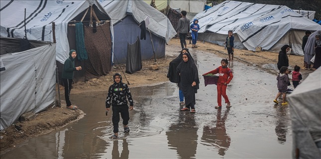 25 Palestinians killed by severe weather as Israeli forces flood displaced Gazans’ shelters
