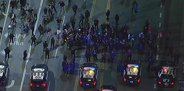 Protest erupts in downtown Los Angeles over US government’s killing of woman