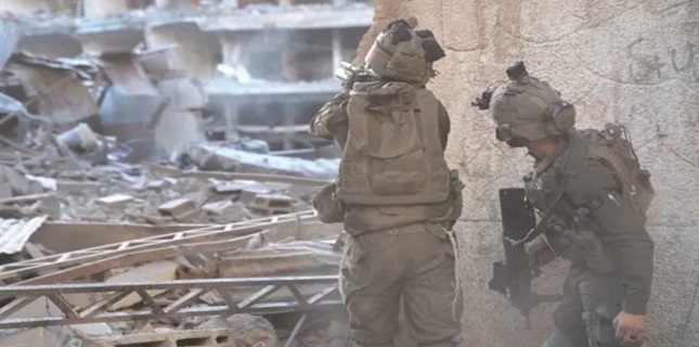 Israeli attacks kill two more Palestinians in Gaza shortly after widespread strikes claim dozens